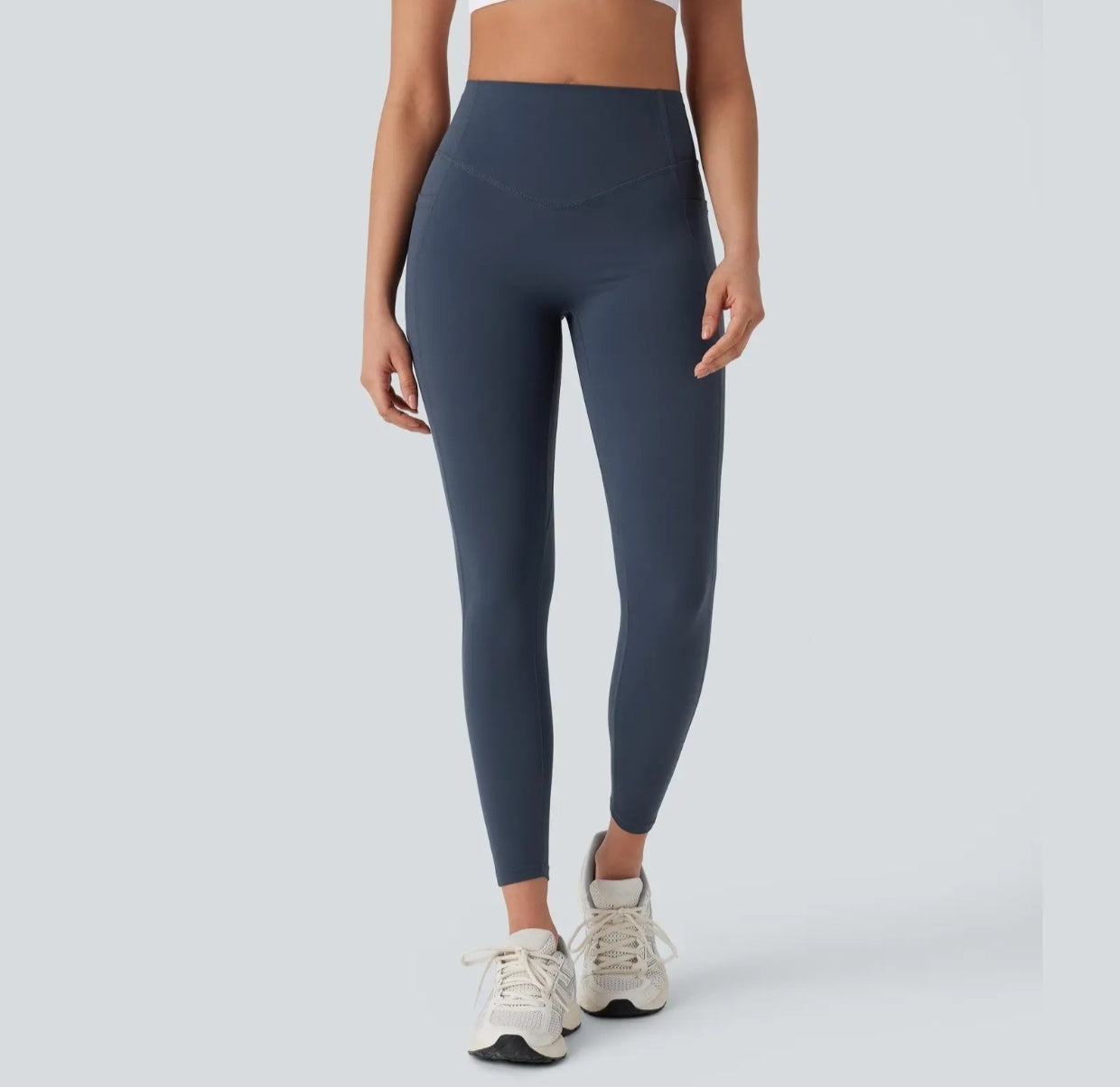High-waisted yoga pants with a V-shaped waistline design that cinches the waist.