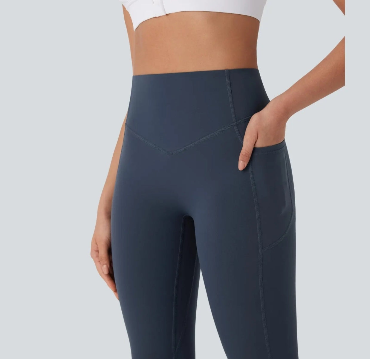 High-waisted yoga pants with a V-shaped waistline design that cinches the waist.