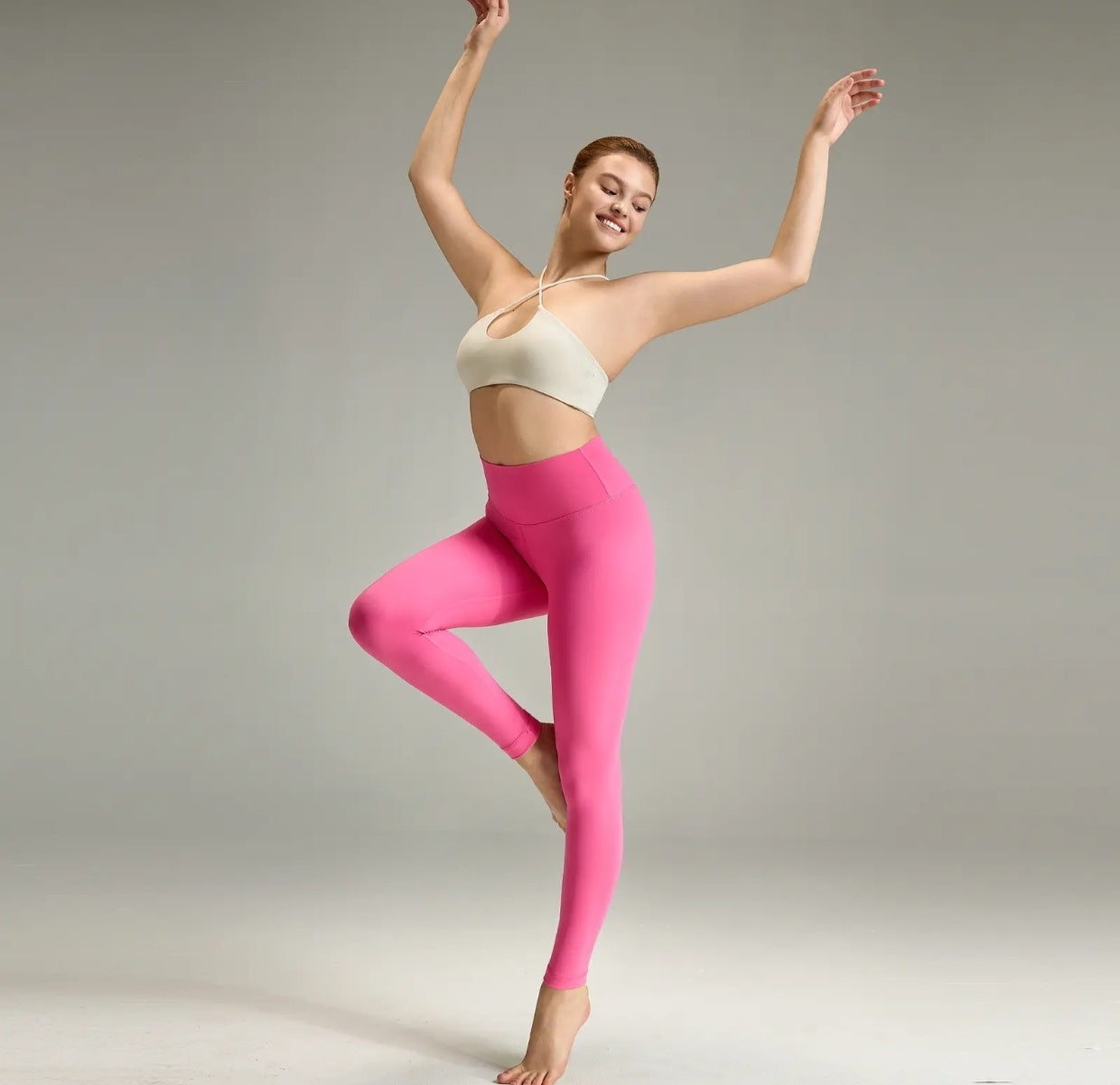 High-waisted yoga pants with a V-shaped waistline design that cinches the waist.